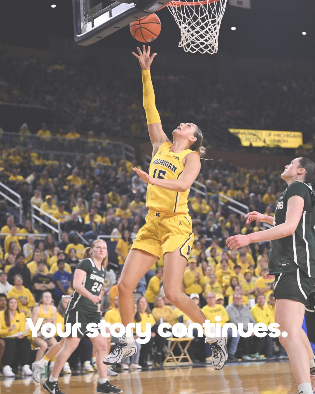 Ashley Sofilkanich going up for a layup for Michigan. Your story continues.